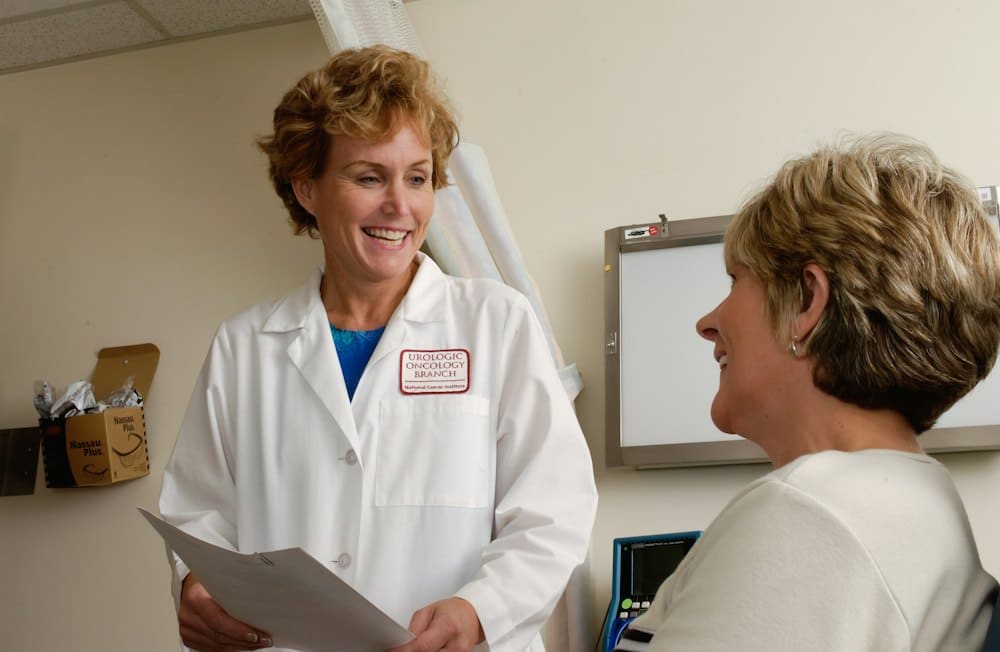 Doctor chatting with a patient in a consultation room