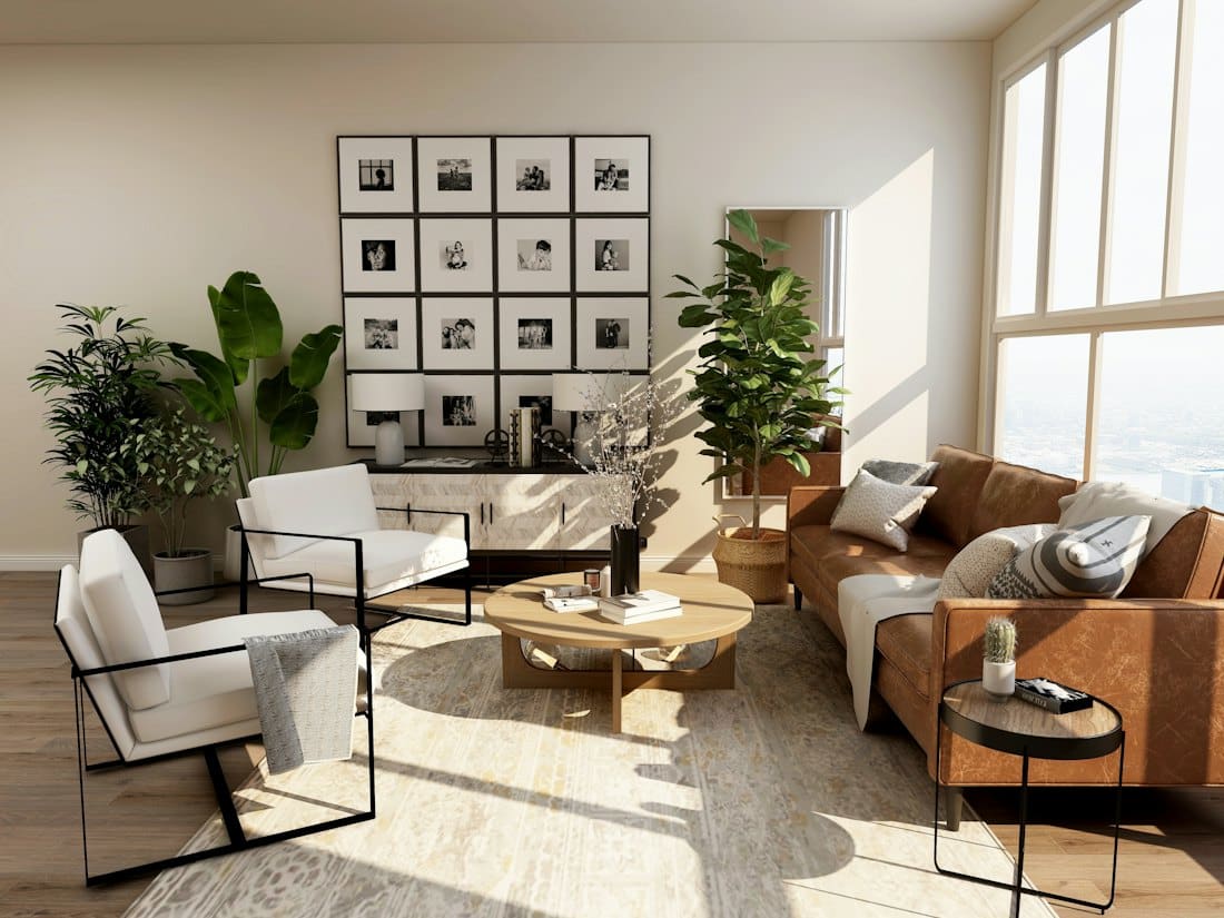 Styled living space with gallery wall, leather sofa and plants